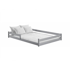 The light grey wooden bed frame with white bedding and pillows
