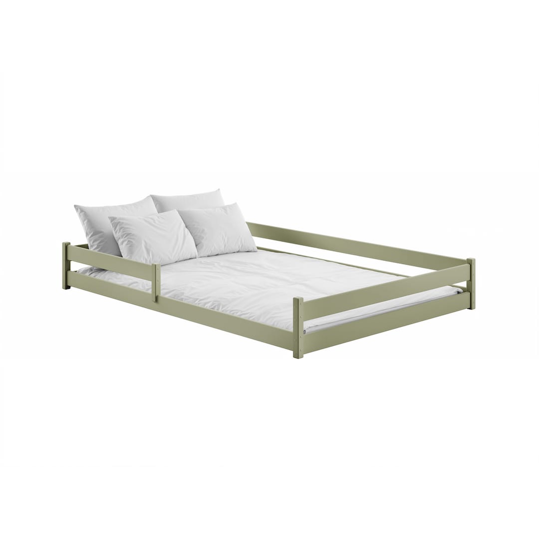 The sage green wooden bed frame with white bedding and pillows