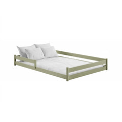 The sage green wooden bed frame with white bedding and pillows