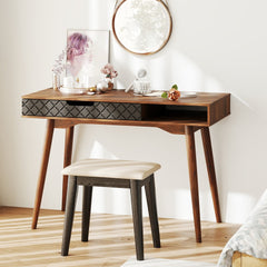 The office desk is shown in a bedroom setting with a stool and mirror