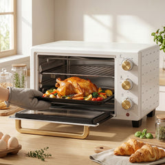 HOMCOM 21L Mini Countertop Oven, the small kitchen appliance with a roasted chicken and vegetables inside