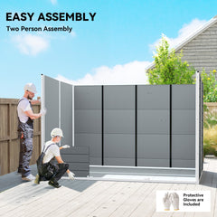 Two people assembling the grey garden shed, showing the construction process
