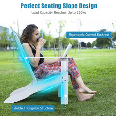 A woman sitting in a white Adirondack chair in a garden