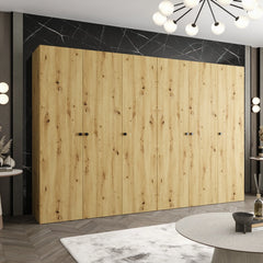 The hinged wardrobe in a room with a wood effect finish and black marble wall