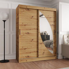The oak effect sliding door wardrobe in a room with a floor lamp and wooden floor