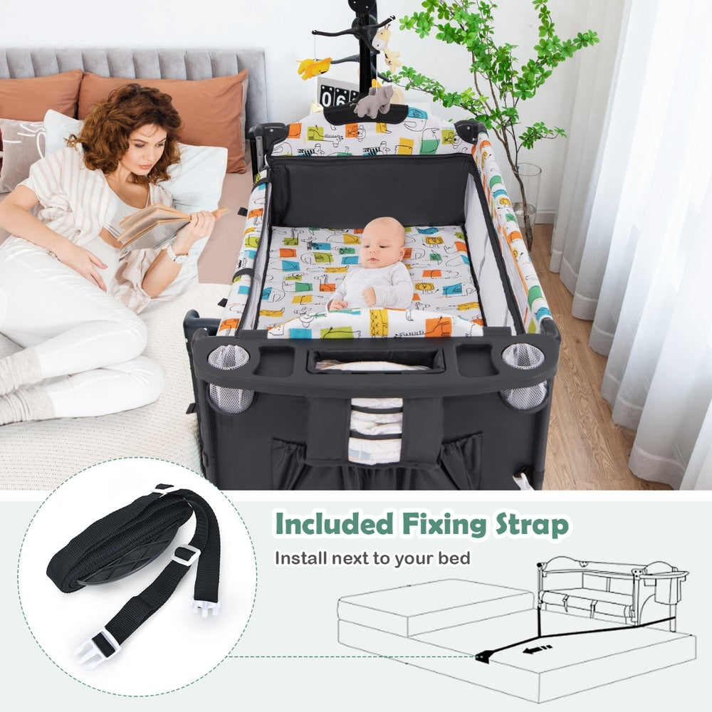 Grey bassinet bedside sleeper with fixing straps and instructions for bed attachment
