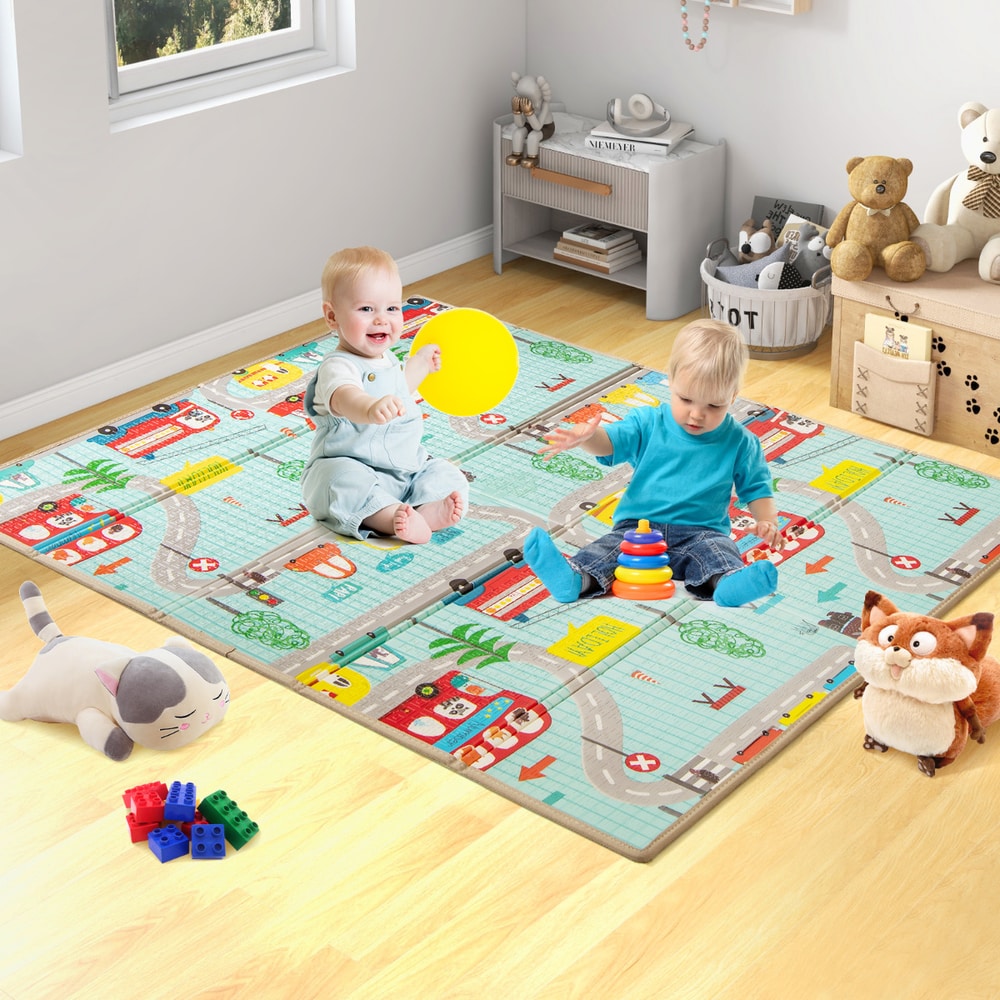 Two babies playing on the foldable baby activity mat with a city road pattern