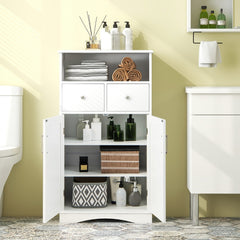 White floor cabinet in a bathroom, filled with various bathroom items