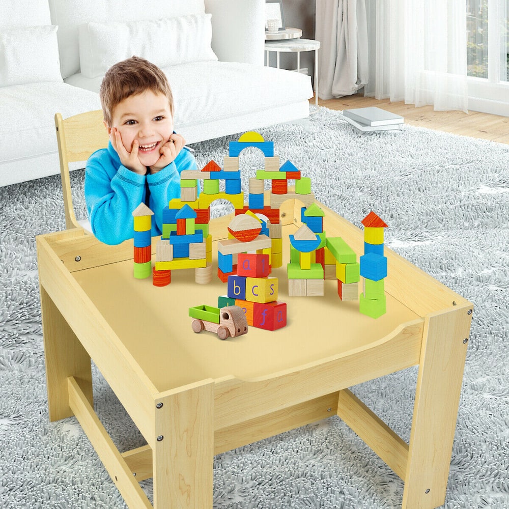 The kids table and chair set with a boy playing with colourful wooden building blocks