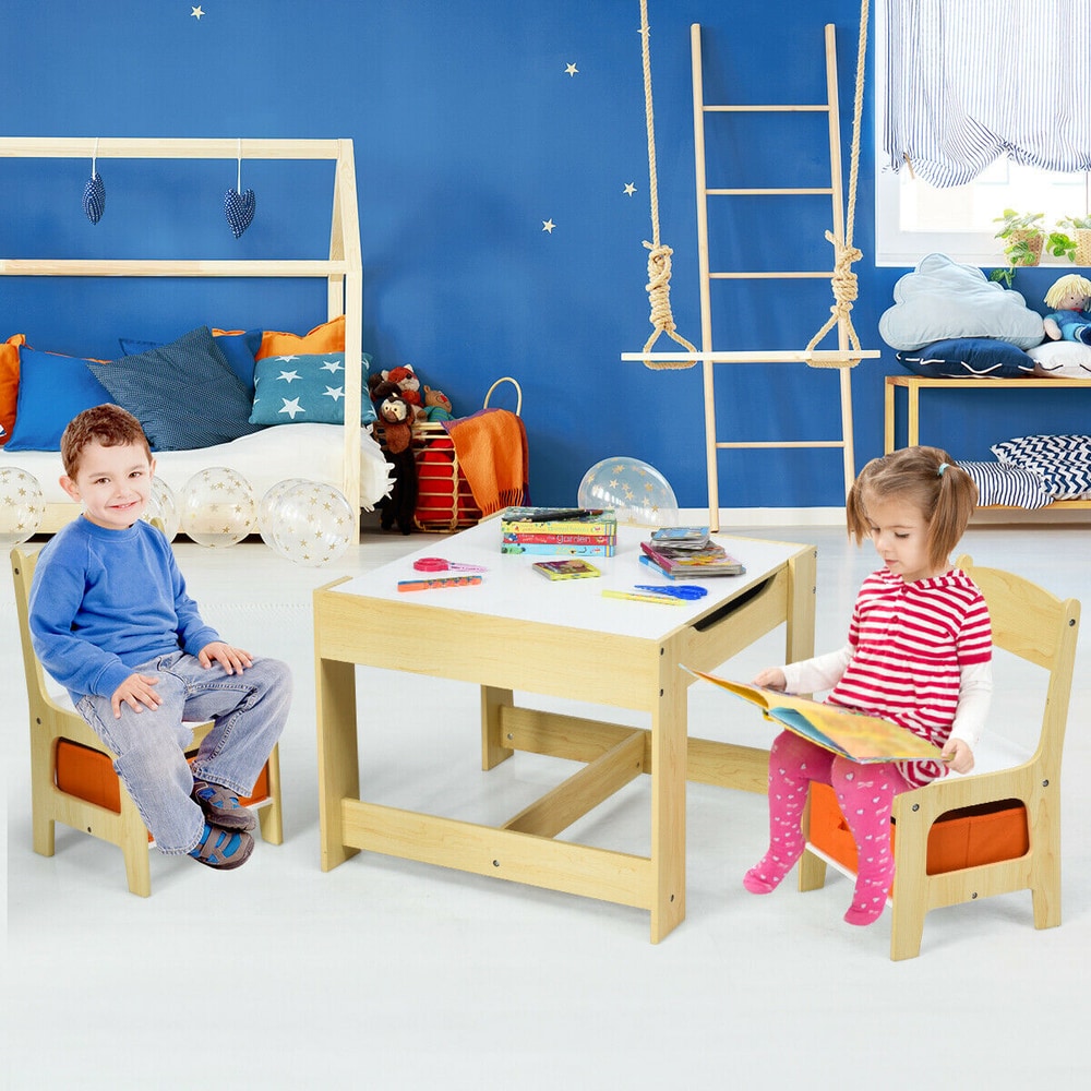 The kids table and chair set in a child's bedroom with a boy and girl sitting and reading
