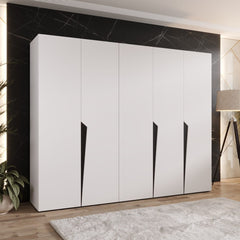 The hinged wardrobe in a crisp white finish standing in a stylish room with a rug