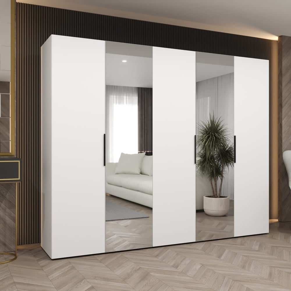 A white Marbella II Hinged Door Wardrobe 250cm with mirrored doors in a room