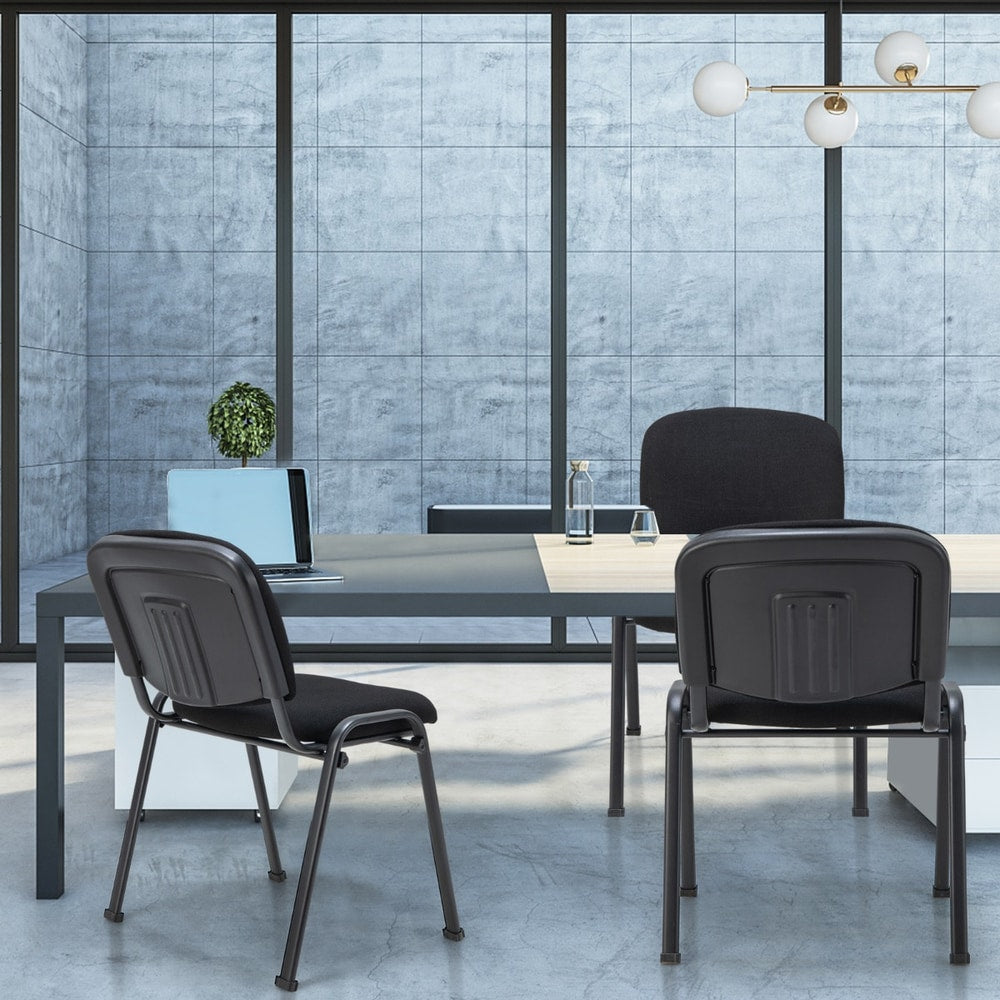 Three black conference chairs arranged in a meeting room