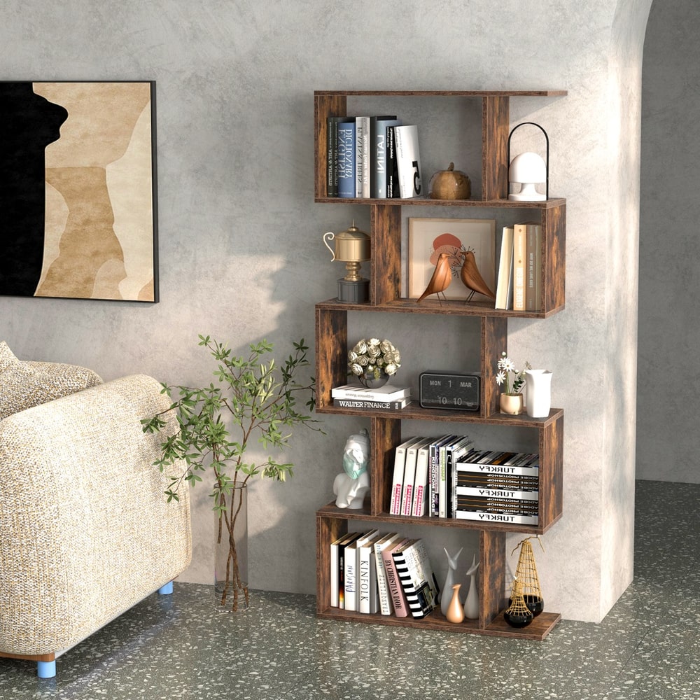 The brown S-shaped bookcase filled with books and ornaments in a domestic setting