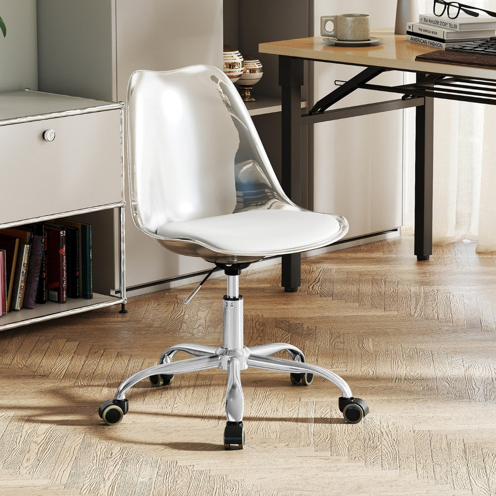The office chair positioned in a home study area with wooden flooring and a desk in the back