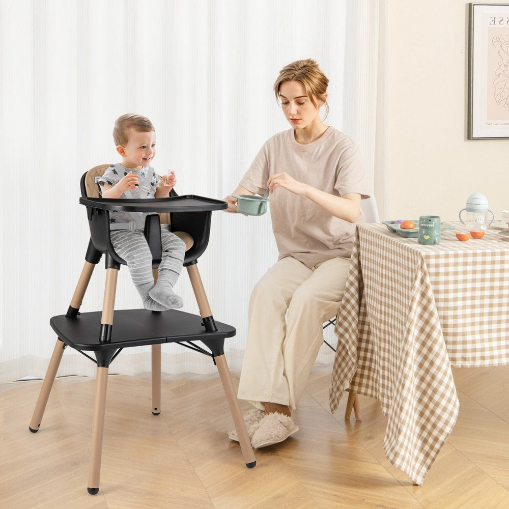 The high chair in use with a baby sitting at a dining table next to an adult