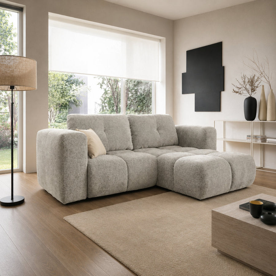 Corner Sofa Bed Modi I in a light grey fabric shown in a bright living room setting
