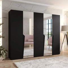 A black hinged wardrobe with mirrored doors in a contemporary living space