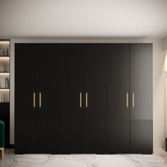 The Manhattan III Hinged Door Wardrobe 300cm in black, featuring ribbed doors and gold handles, presented closed