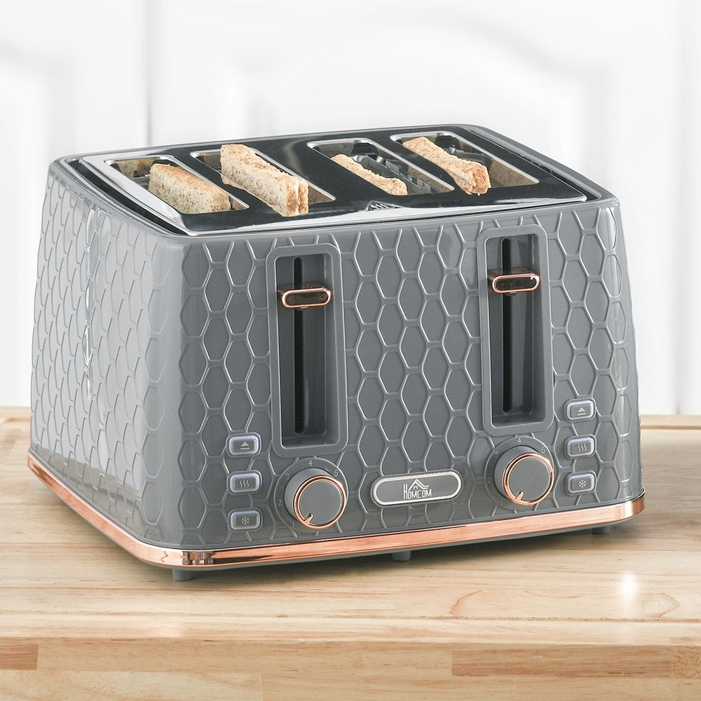 The grey four-slice toaster with four slices of toast in the slots, on a wooden surface