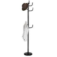 The modern coat stand hanger with a hat and jacket hanging on the hooks