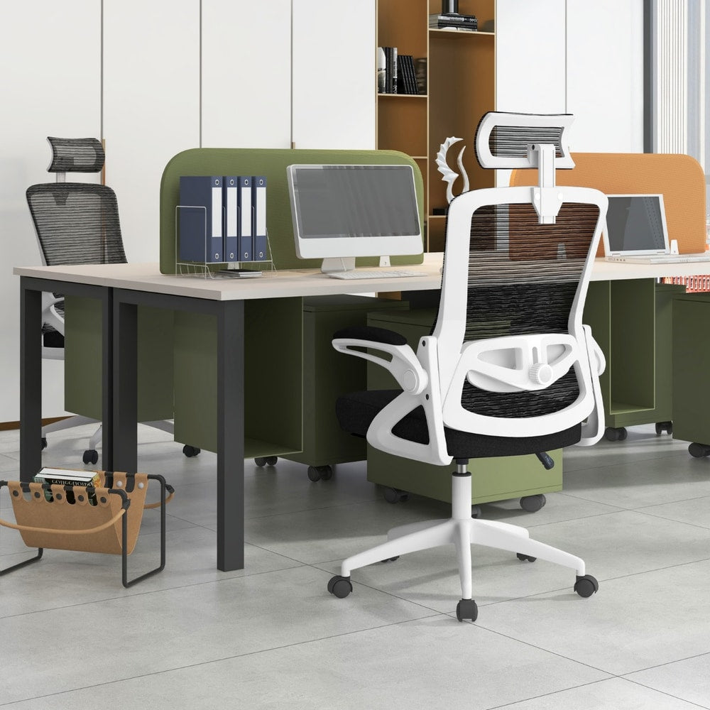 The office chair positioned at a desk in a bright modern workspace