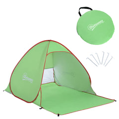 The beach shelter shown with its circular carry bag and several metal ground pegs