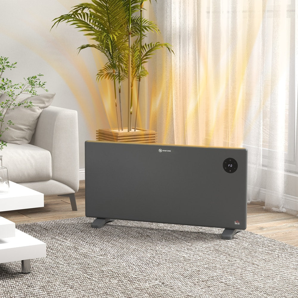 The electric heater standing on a rug in a living room with warm air rising from the top