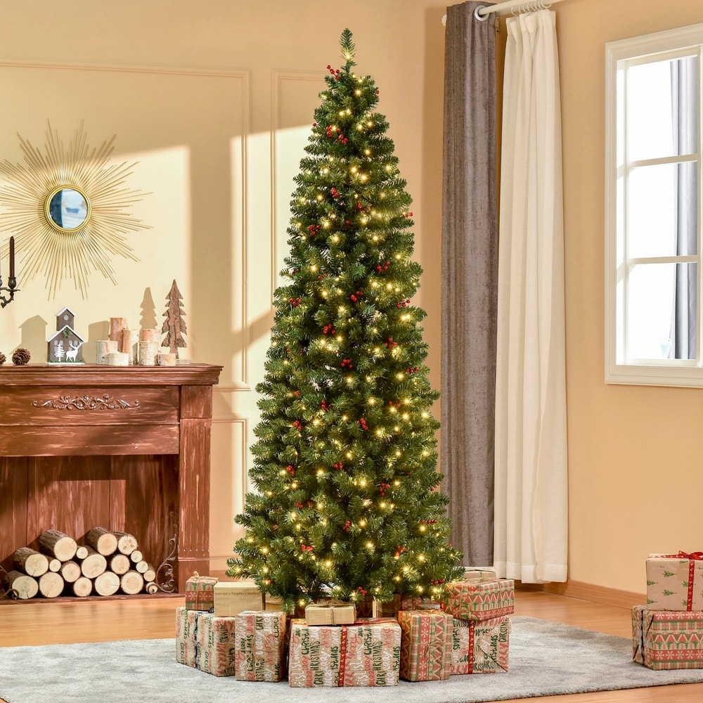 The pencil Christmas tree is decorated with presents and placed in a cosy living room setting