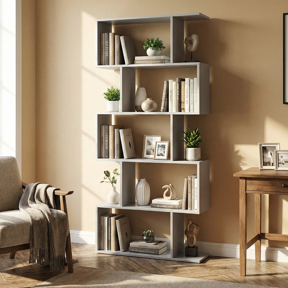 The grey shelving unit filled with decorative items and books in a living room