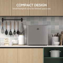 The compact freezer is shown in a kitchen setting, highlighting its small footprint