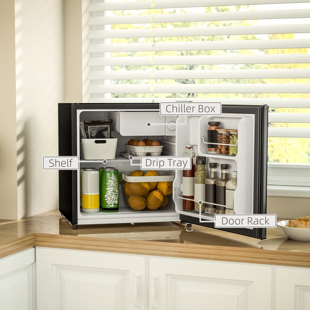 Open black countertop fridge showing a shelf, door rack, and chiller box with items