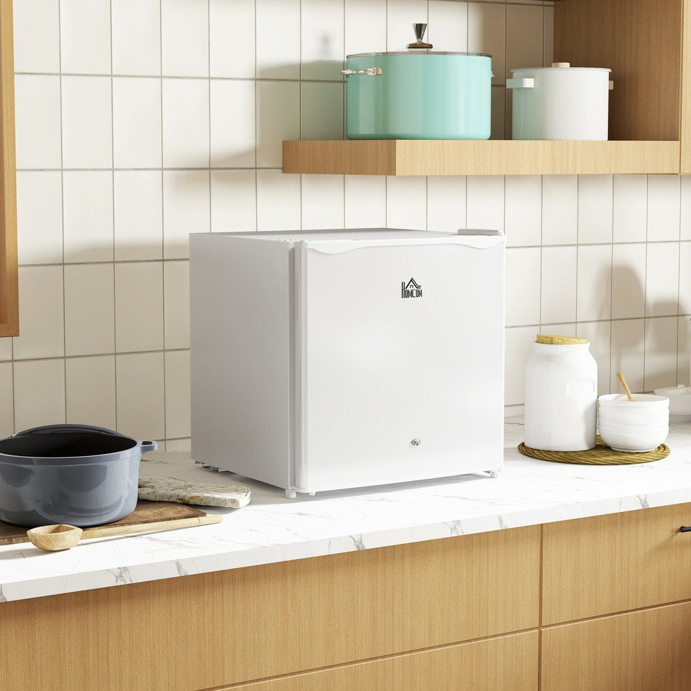 The small kitchen appliance placed on a wooden countertop in a bright modern kitchen setting