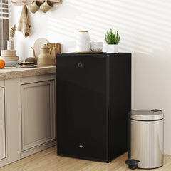 The black under-counter fridge placed in a modern kitchen setting next to a bin