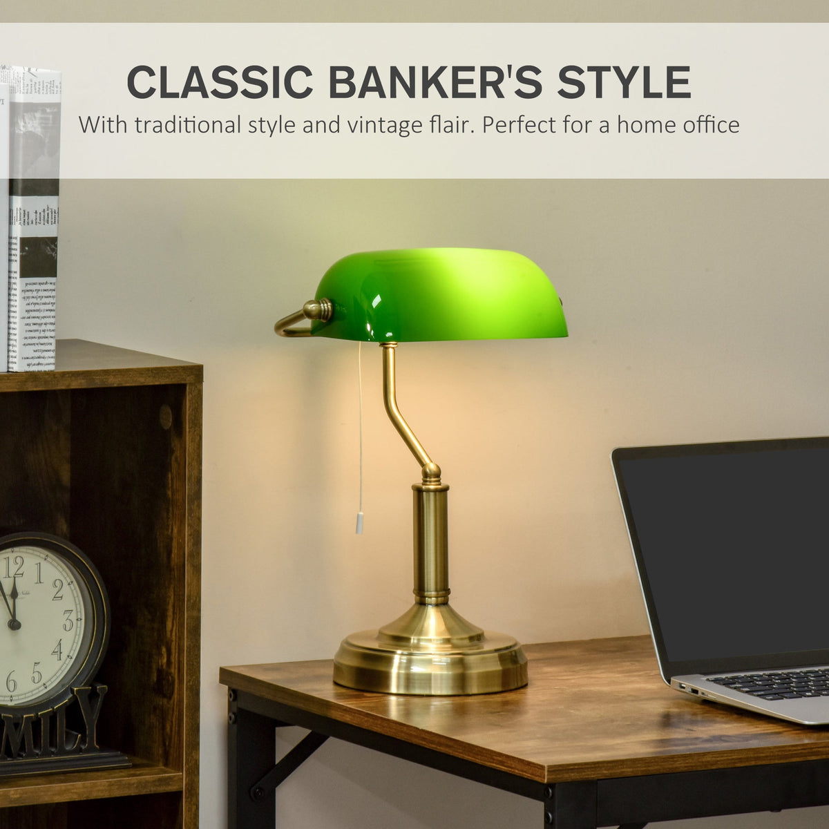 The banker's desk lamp with green glass shade on a wooden desk next to a laptop