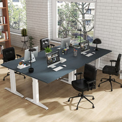 The office chair placed around a large shared desk in a modern open plan office environment