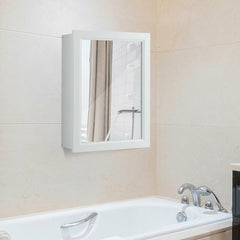 The wall cabinet mounted on a tiled bathroom wall above a white bathtub
