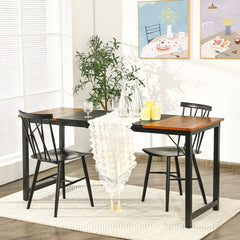 The modern computer desk used as a kitchen table with chairs and a table runner