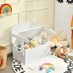 The white kids table and chair set with its storage box lid open, filled with toys