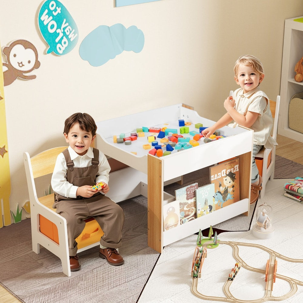 The kids table and chair set with two children playing with blocks and reading books