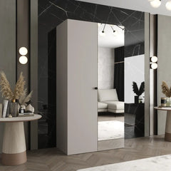 The hinged wardrobe in a light grey finish with a mirrored door