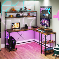 The office desk illuminated with colourful LED lights in a gaming room setup