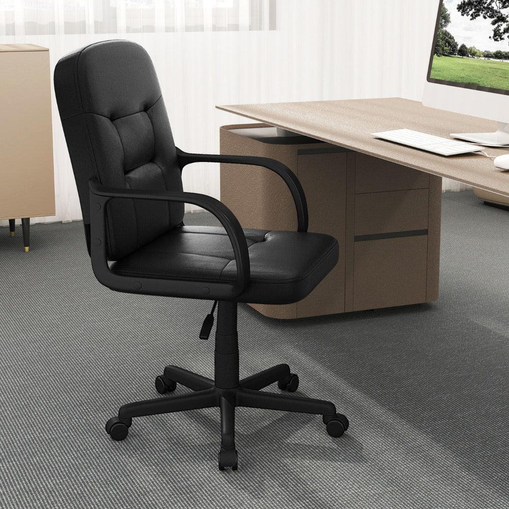The swivel chair in a modern home office with a computer on the desk