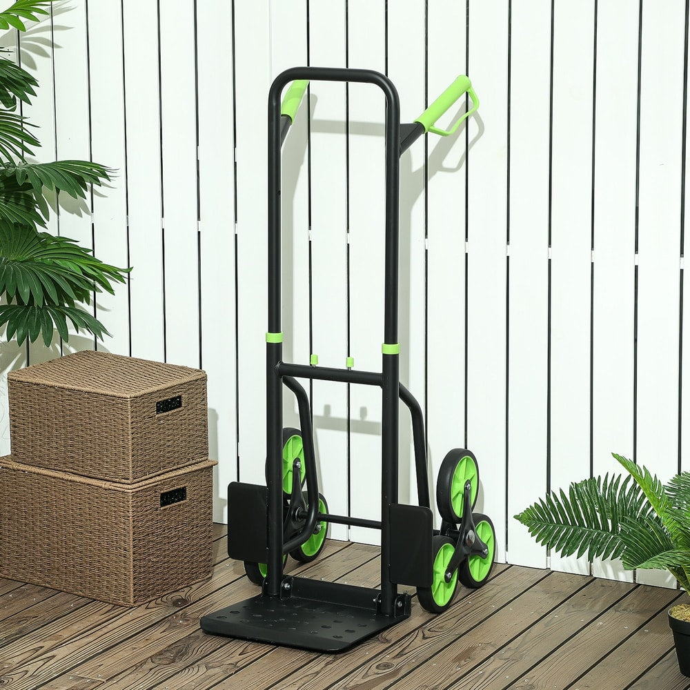 The folding sack barrow standing on a wooden deck next to two wicker storage boxes