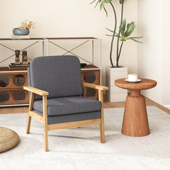 The accent chair placed in a bright living room next to a small wooden side table