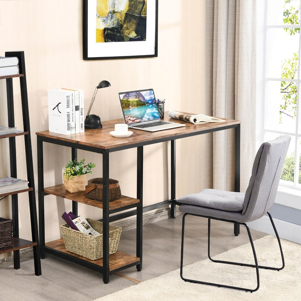 The office desk set up in a bright room with a laptop and a grey chair placed beside it