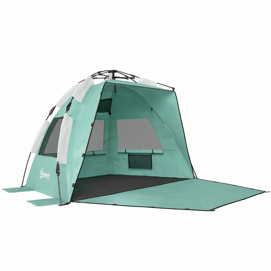 Outsunny 2-3 Person Pop Up Beach Tent set up on a beach with the front open