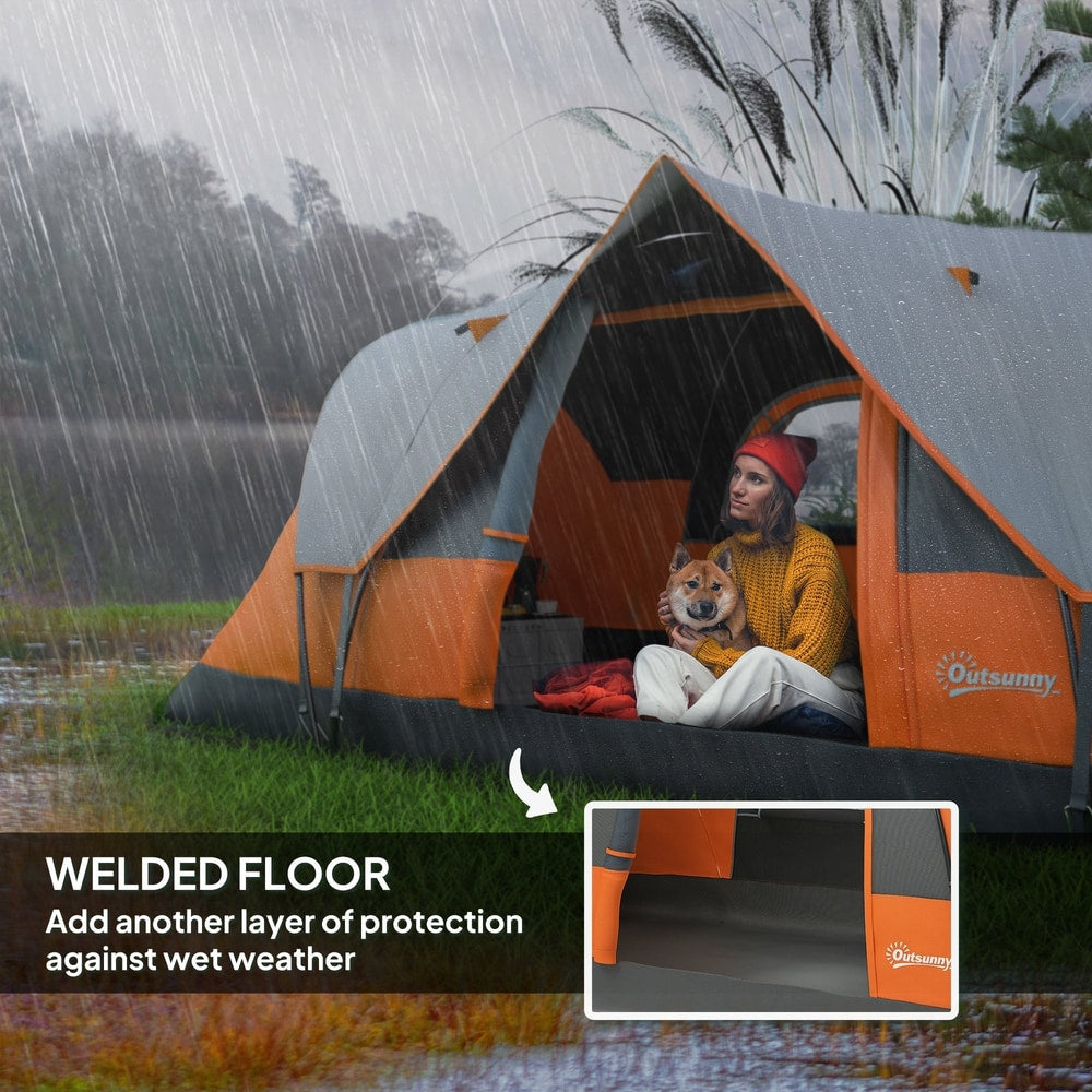 Inside the orange and grey dome camping tent during rainfall, showing the welded floor for protection
