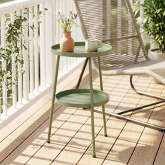 The two-tier round coffee end table on a balcony with a chair and plants