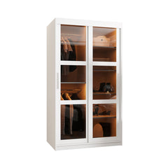 The sliding door wardrobe with glass doors showing clothes inside